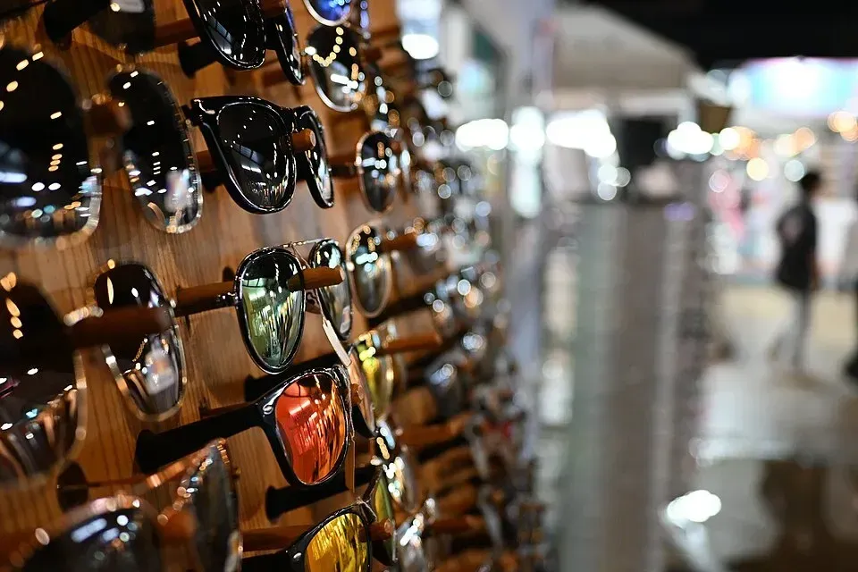 Close-up display of sunglasses on a rack