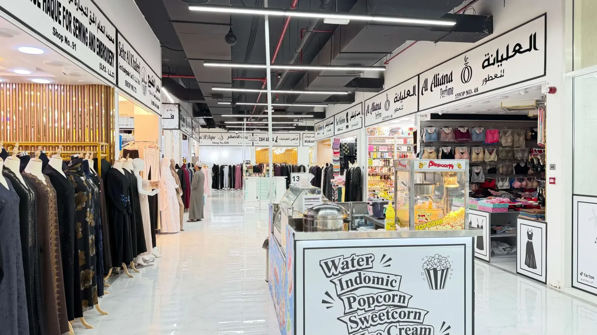Interior aisle at Salem Mall with abaya and perfume shops
